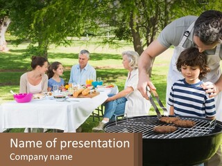 A Man Grilling Meat On A Grill With People Sitting Around PowerPoint Template
