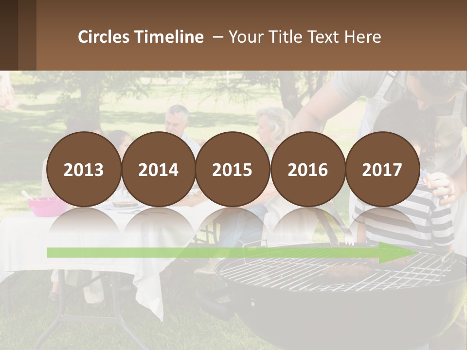 A Man Grilling Meat On A Grill With People Sitting Around PowerPoint Template