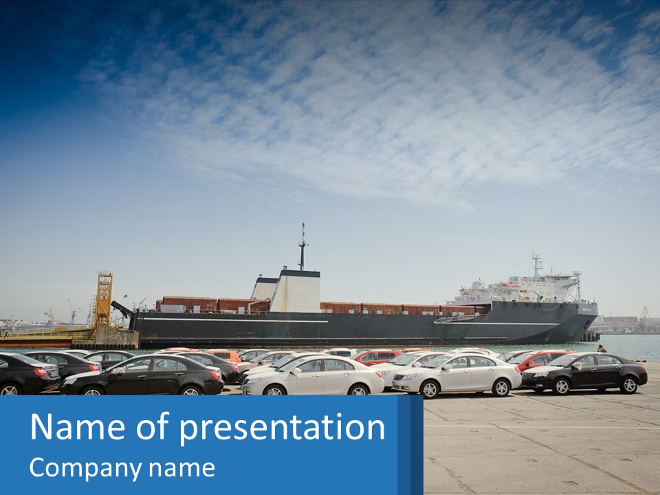 A Large Boat Is In The Water Next To Many Cars PowerPoint Template