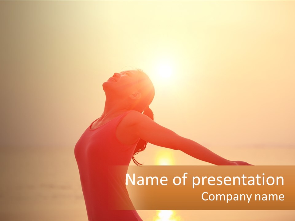 A Woman Standing On A Beach With Her Arms Outstretched PowerPoint Template
