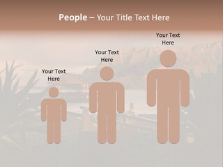 A Boat Is Docked On A Lake With Mountains In The Background PowerPoint Template