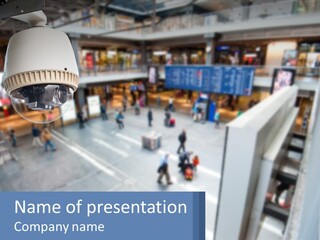 A Security Camera Hanging From The Ceiling Of A Building PowerPoint Template