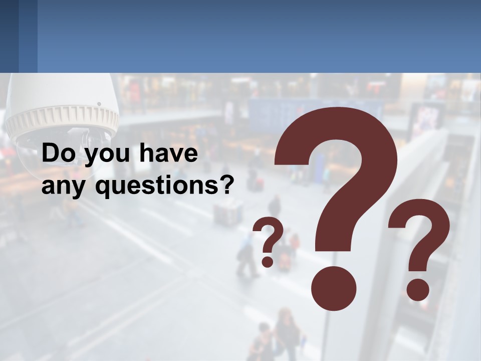 A Security Camera Hanging From The Ceiling Of A Building PowerPoint Template