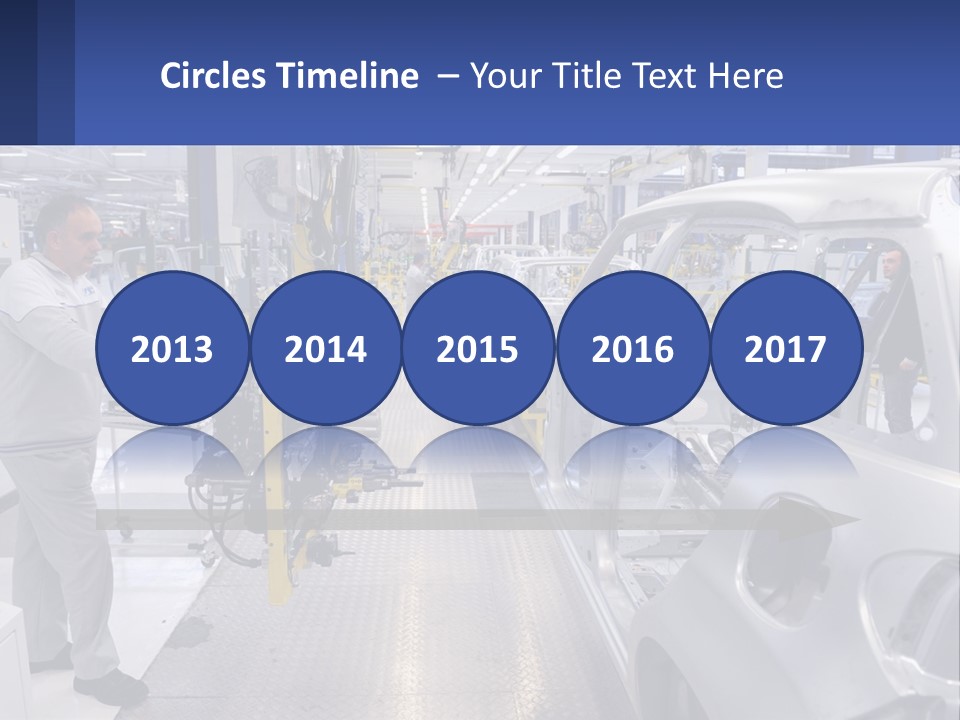 A Man Is Working On A Car In A Factory PowerPoint Template