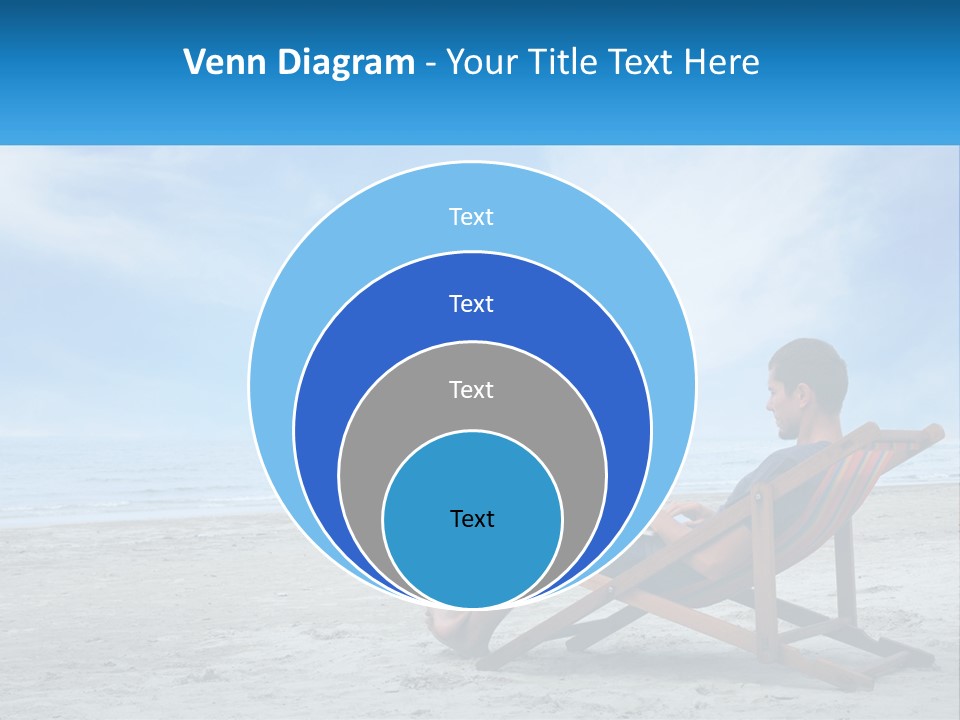 A Man Sitting In A Chair On A Beach Using A Laptop PowerPoint Template