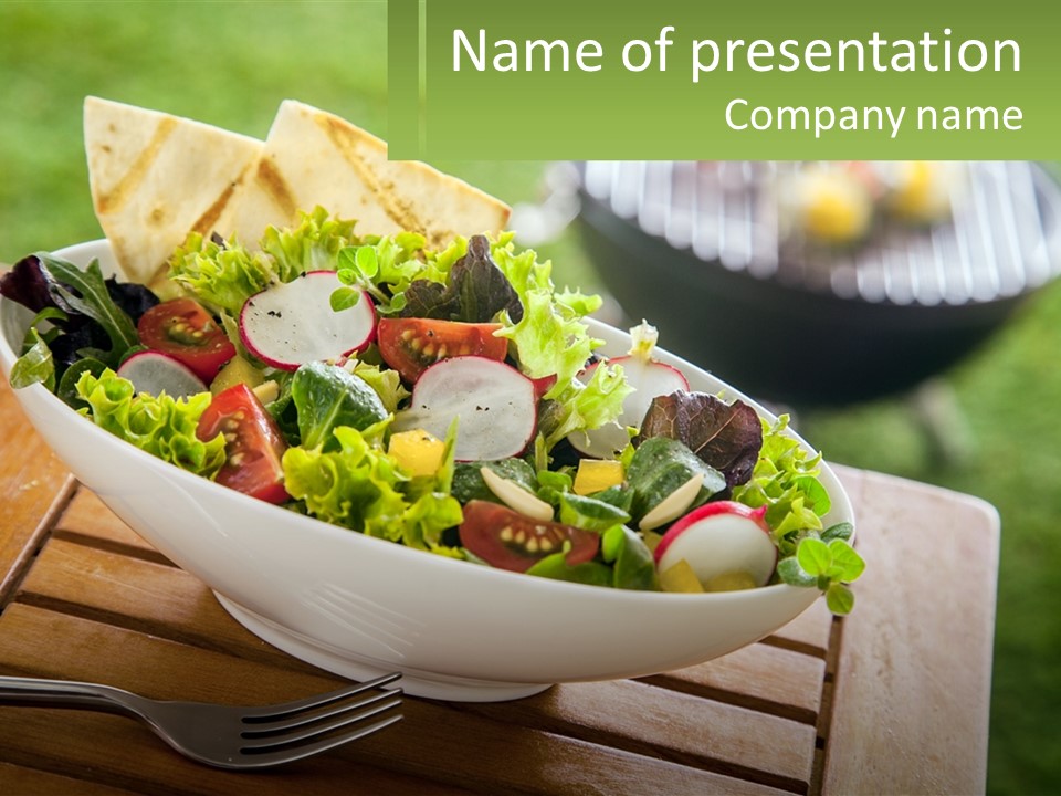 A Bowl Of Salad With Tortilla Chips On The Side PowerPoint Template