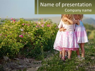 Two Little Girls Hugging Each Other In A Field PowerPoint Template