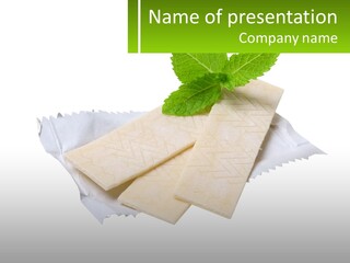 A Piece Of Cheese With A Green Leaf On Top Of It PowerPoint Template
