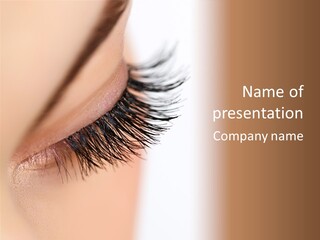 A Close Up Of A Woman's Eye With Long Lashes PowerPoint Template