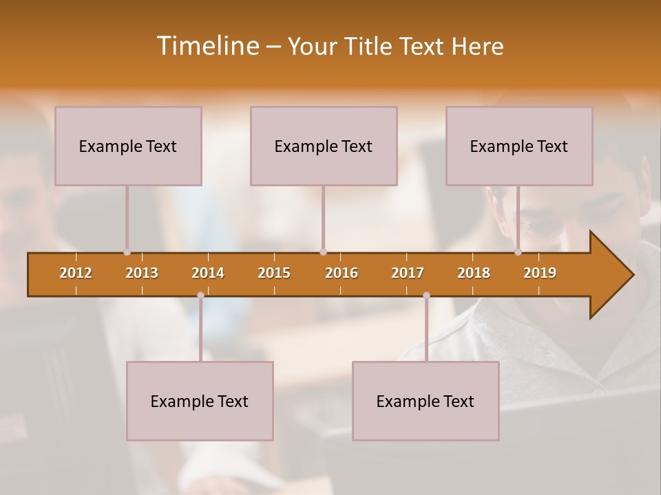 A Group Of People Working On Computers In A Classroom PowerPoint Template