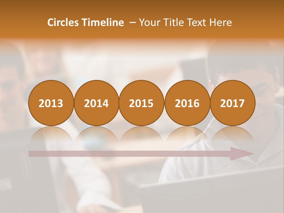 A Group Of People Working On Computers In A Classroom PowerPoint Template