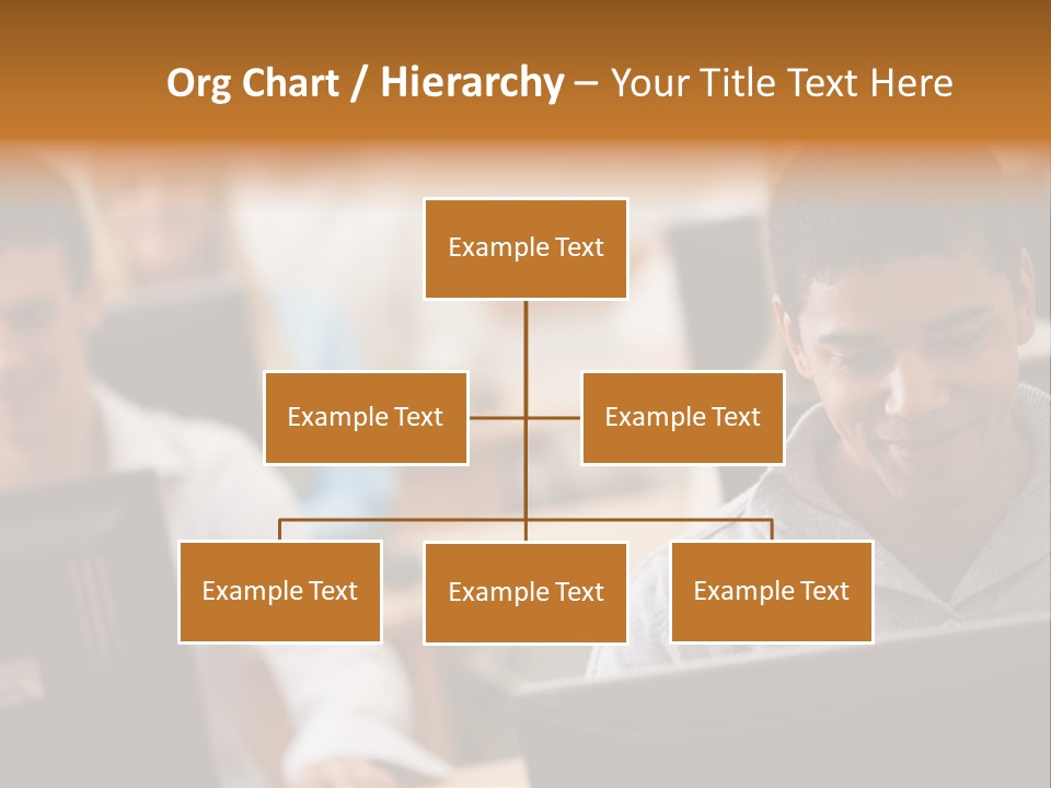 A Group Of People Working On Computers In A Classroom PowerPoint Template