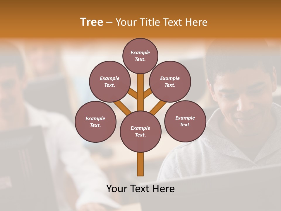 A Group Of People Working On Computers In A Classroom PowerPoint Template