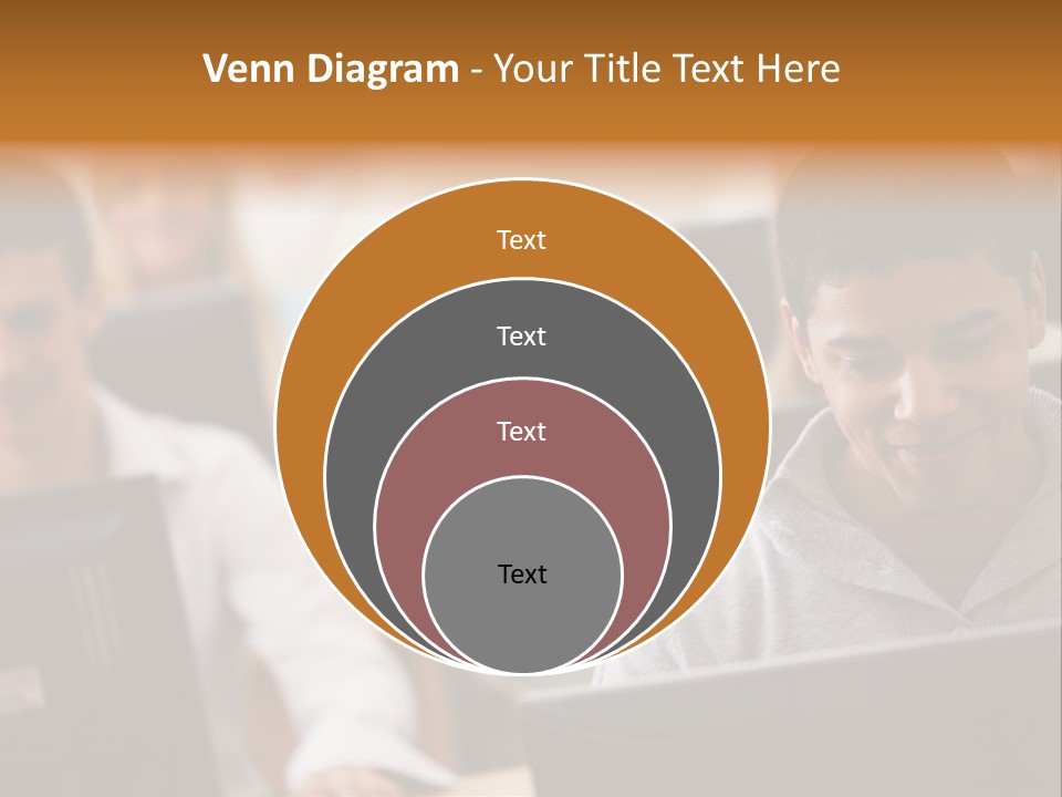 A Group Of People Working On Computers In A Classroom PowerPoint Template