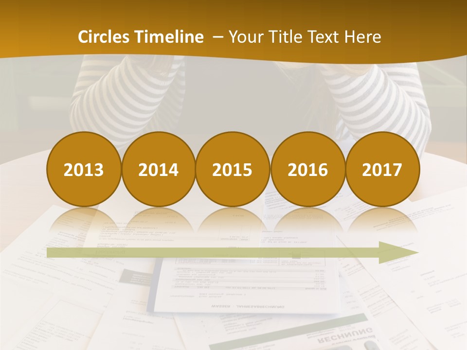 A Woman Sitting At A Table With A Calculator And Papers PowerPoint Template