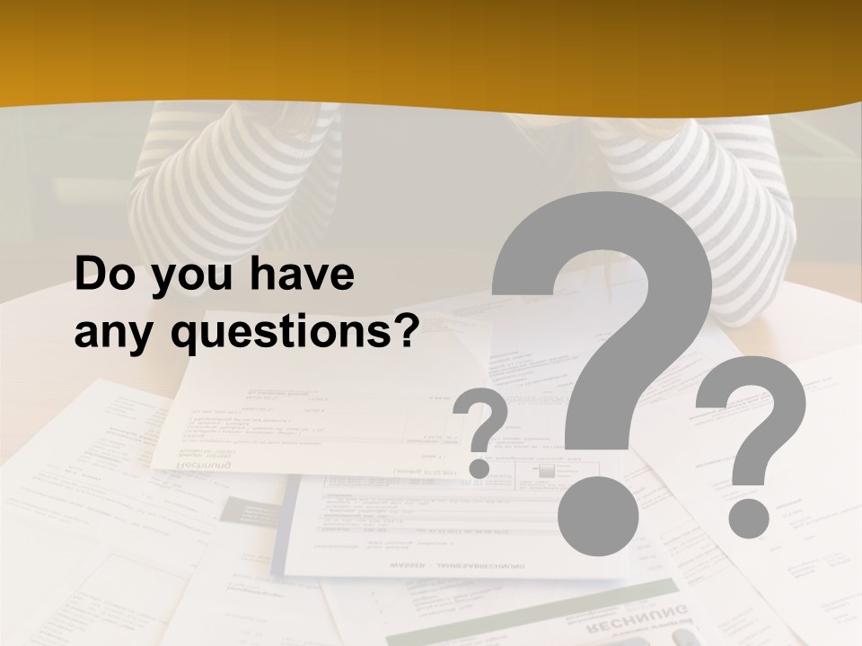 A Woman Sitting At A Table With A Calculator And Papers PowerPoint Template