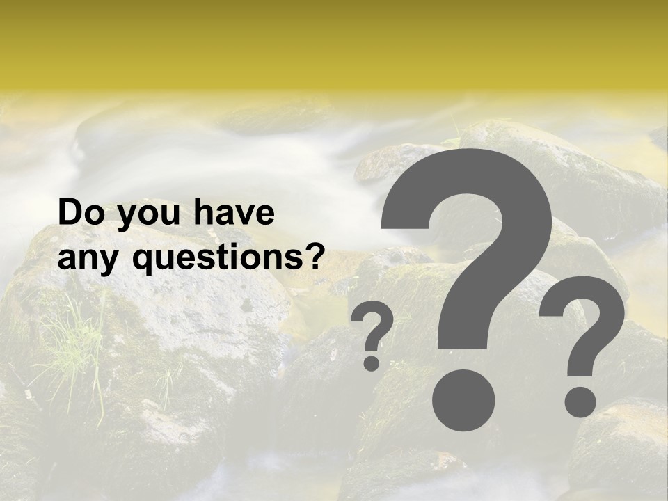 A Stream Of Water Surrounded By Rocks And Grass PowerPoint Template