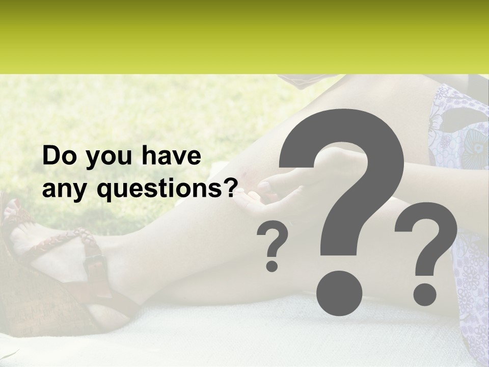A Woman Is Sitting On The Grass With Her Foot On The Ground PowerPoint Template