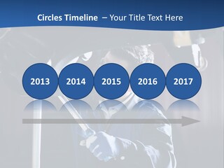 A Man Working On A Car In A Garage PowerPoint Template