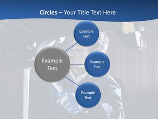 A Man Working On A Car In A Garage PowerPoint Template