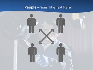 A Man Working On A Car In A Garage PowerPoint Template
