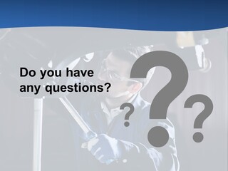 A Man Working On A Car In A Garage PowerPoint Template