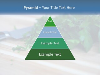A Bunch Of Green Leaves On A Cutting Board With A Knife PowerPoint Template