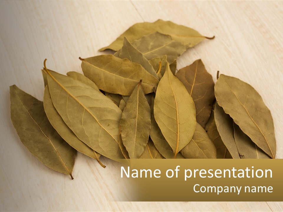 A Pile Of Leaves Sitting On Top Of A Wooden Table PowerPoint Template