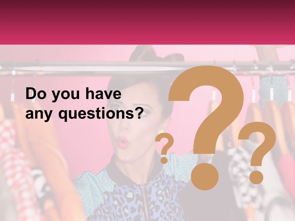 A Woman Standing In Front Of A Rack Of Clothes PowerPoint Template