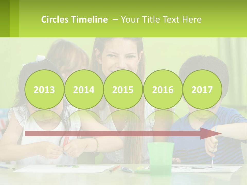 A Woman Sitting At A Table With Two Children PowerPoint Template