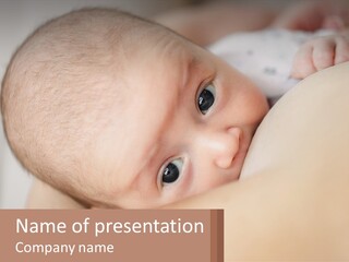 A Baby Laying On Top Of A Bed Next To A Pillow PowerPoint Template