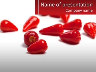 A Group Of Red Peppers On A White Surface PowerPoint Template