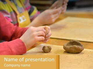 A Child Is Playing With A Cookie On A Table PowerPoint Template