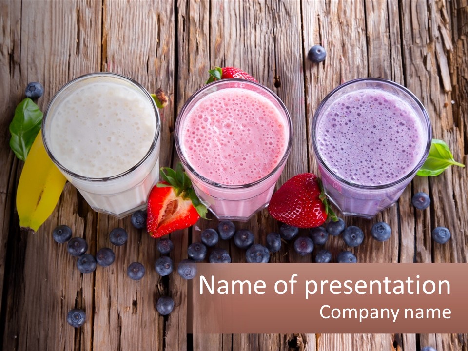 Three Glasses Of Smoothie With Strawberries And Blueberries On A Wooden Table PowerPoint Template