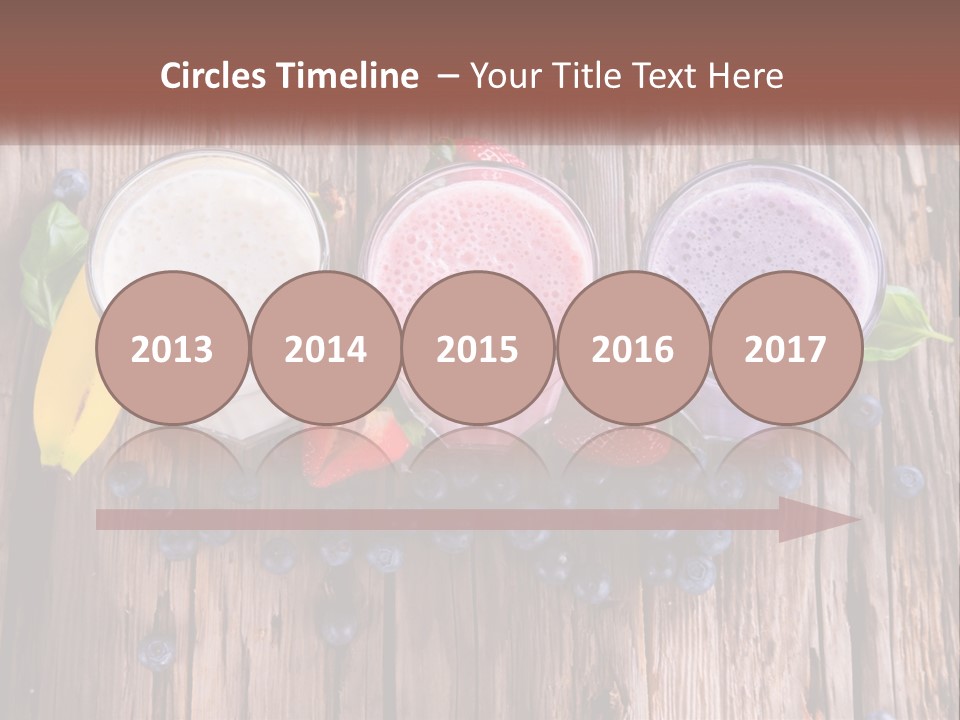 Three Glasses Of Smoothie With Strawberries And Blueberries On A Wooden Table PowerPoint Template