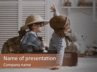 Two Children In Hats Sitting On A Suitcase PowerPoint Template