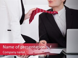 A Man In A Suit Is Tying A Tie PowerPoint Template