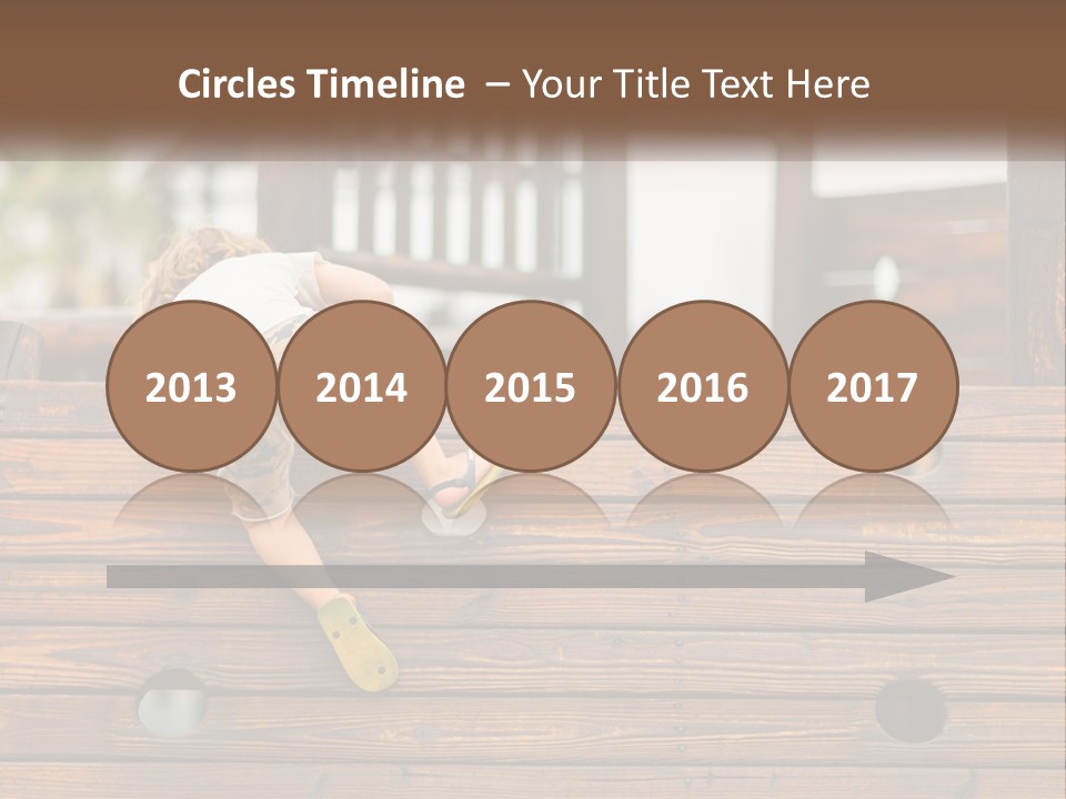 A Young Child Climbing Up A Wooden Slide PowerPoint Template