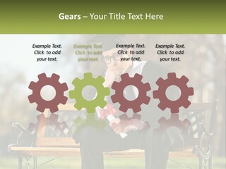 A Man In A Graduation Gown Sitting On A Bench PowerPoint Template