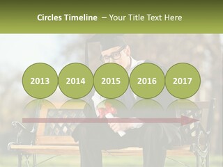 A Man In A Graduation Gown Sitting On A Bench PowerPoint Template