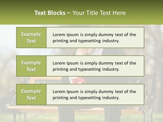 A Man In A Graduation Gown Sitting On A Bench PowerPoint Template