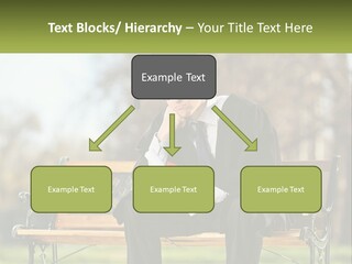 A Man In A Graduation Gown Sitting On A Bench PowerPoint Template