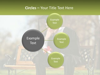 A Man In A Graduation Gown Sitting On A Bench PowerPoint Template