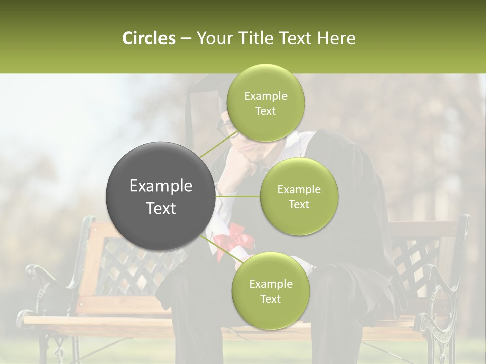 A Man In A Graduation Gown Sitting On A Bench PowerPoint Template