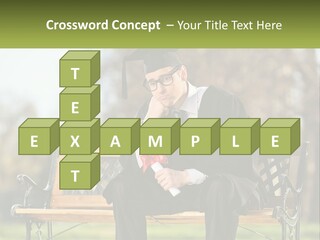 A Man In A Graduation Gown Sitting On A Bench PowerPoint Template