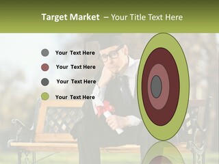 A Man In A Graduation Gown Sitting On A Bench PowerPoint Template