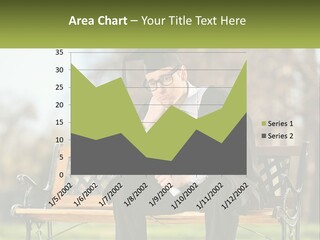 A Man In A Graduation Gown Sitting On A Bench PowerPoint Template