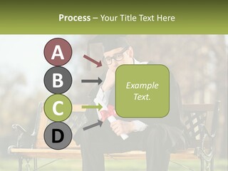 A Man In A Graduation Gown Sitting On A Bench PowerPoint Template