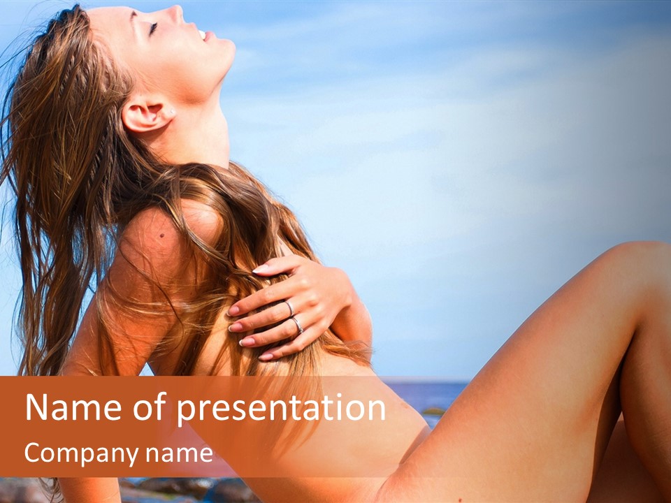 A Woman Is Sitting On The Beach With Her Hair Blowing In The Wind PowerPoint Template