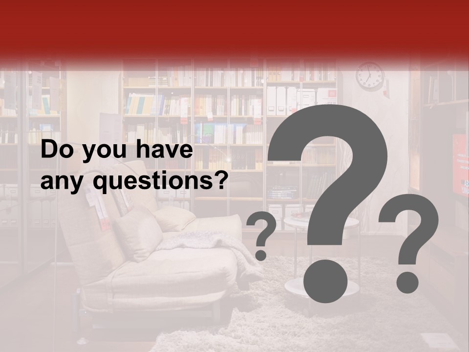 A Living Room With A Couch And Bookshelf PowerPoint Template